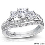 Introducing the Yaffie Gold Diamond Bridal Rings Set, adorned with 1 1/10ct TDW of sparkling diamonds.