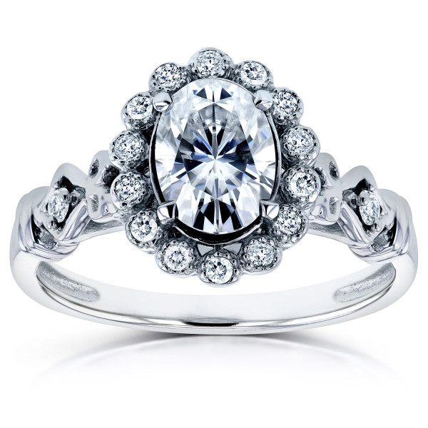 Vintage-inspired Yaffie ring with ornate design, featuring a 1ct Forever Brilliant Moissanite and diamond oval on a white gold band.