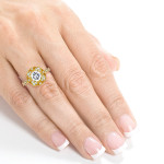 Eternal Beauty: Yaffie Gold Cushion with Forever One Moissanite and 1/4ct TDW Diamond in a Floral Antique Design.