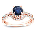 Gold bridal ring set adorned with dazzling 3/5ct blue sapphire and 2/5ct TDW round diamonds - Yaffie masterpiece.