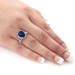 Blue Sapphire Sparkle - Yaffie Gold Oval Cut Sapphire Ring with Diamond Halo Accent (5ct Sapphire, 3/4ct Total Diamond Weight)