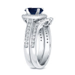 Blue and White Gold Bridal Ring Set adorned with 1ct Sapphire and 1/2ct Total Diamond Weight