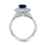 This ring boasts a magnificent 1 1/2ct blue sapphire and 1ct TDW diamond double-halo on a stunning white gold band.