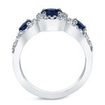 Sapphire Sparkler: Yaffie Platinum 4/5ct Blue Sapphire and 2/5ct TDW Three-Stone Round Cut Diamond Ring.