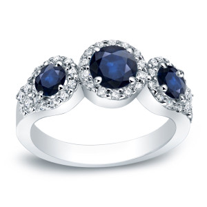 Sapphire Sparkler: Yaffie Platinum 4/5ct Blue Sapphire and 2/5ct TDW Three-Stone Round Cut Diamond Ring.