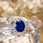 Elegant White Gold Ring with Sapphire and Diamond Halo