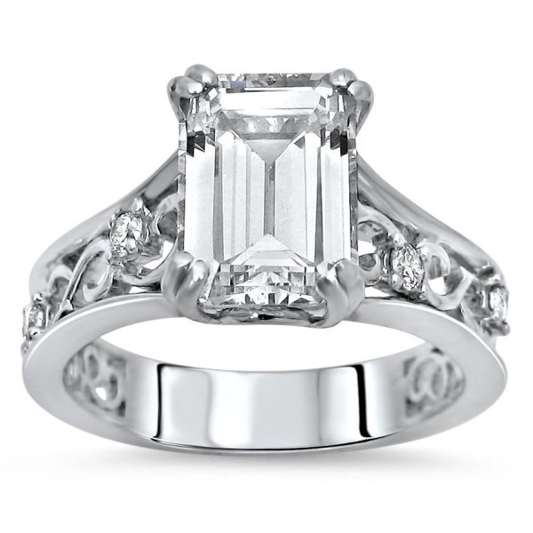 Elegant White Gold Ring with Sparkling Emerald-cut Moissanite and Dazzling Diamond Accent.