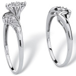 Platinum meets silver with Yaffie round diamond bridal duo, featuring a total carat weight of 1/5.