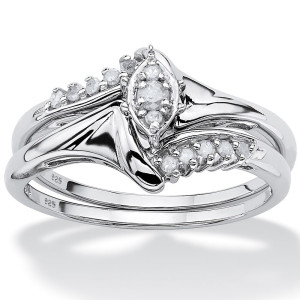 Platinum meets silver with Yaffie round diamond bridal duo, featuring a total carat weight of 1/5.